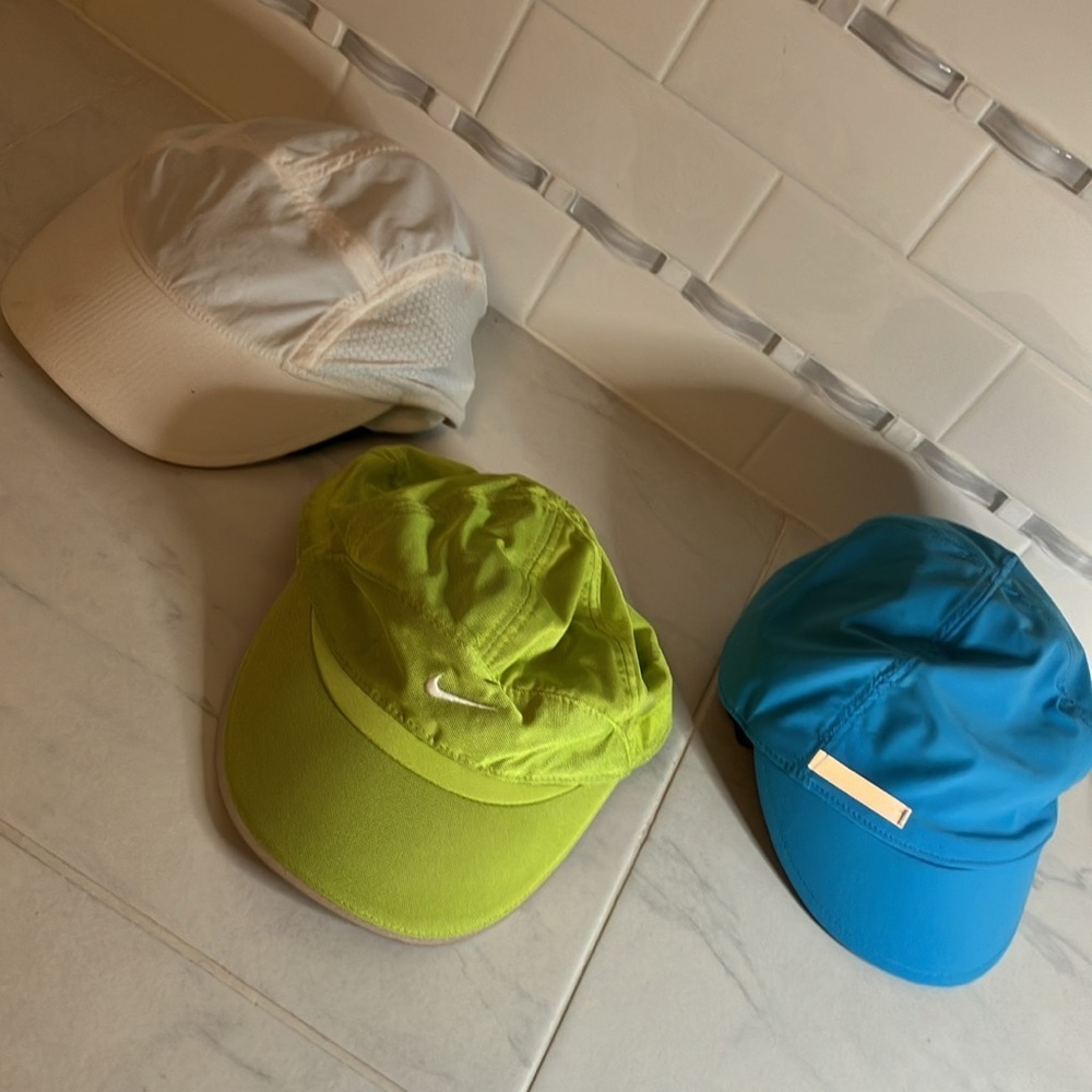 Lululemon and Nike baseball hats / Capra.  White teal green.